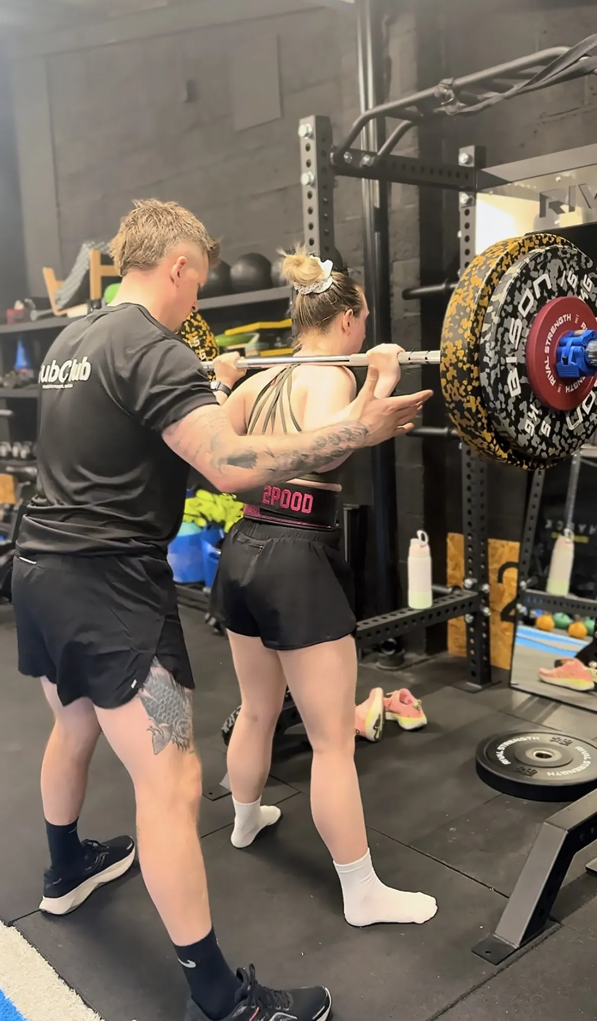 Coached back squat at Physical Formula, the coach watching the rep at Leamington Spa