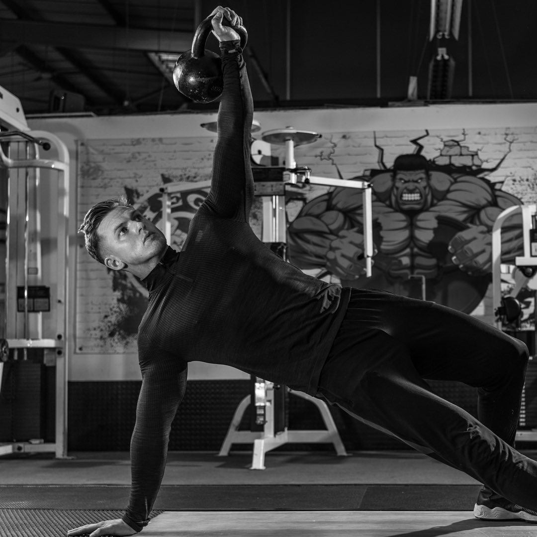 Side plank with kettlebell hold at Physical Formula