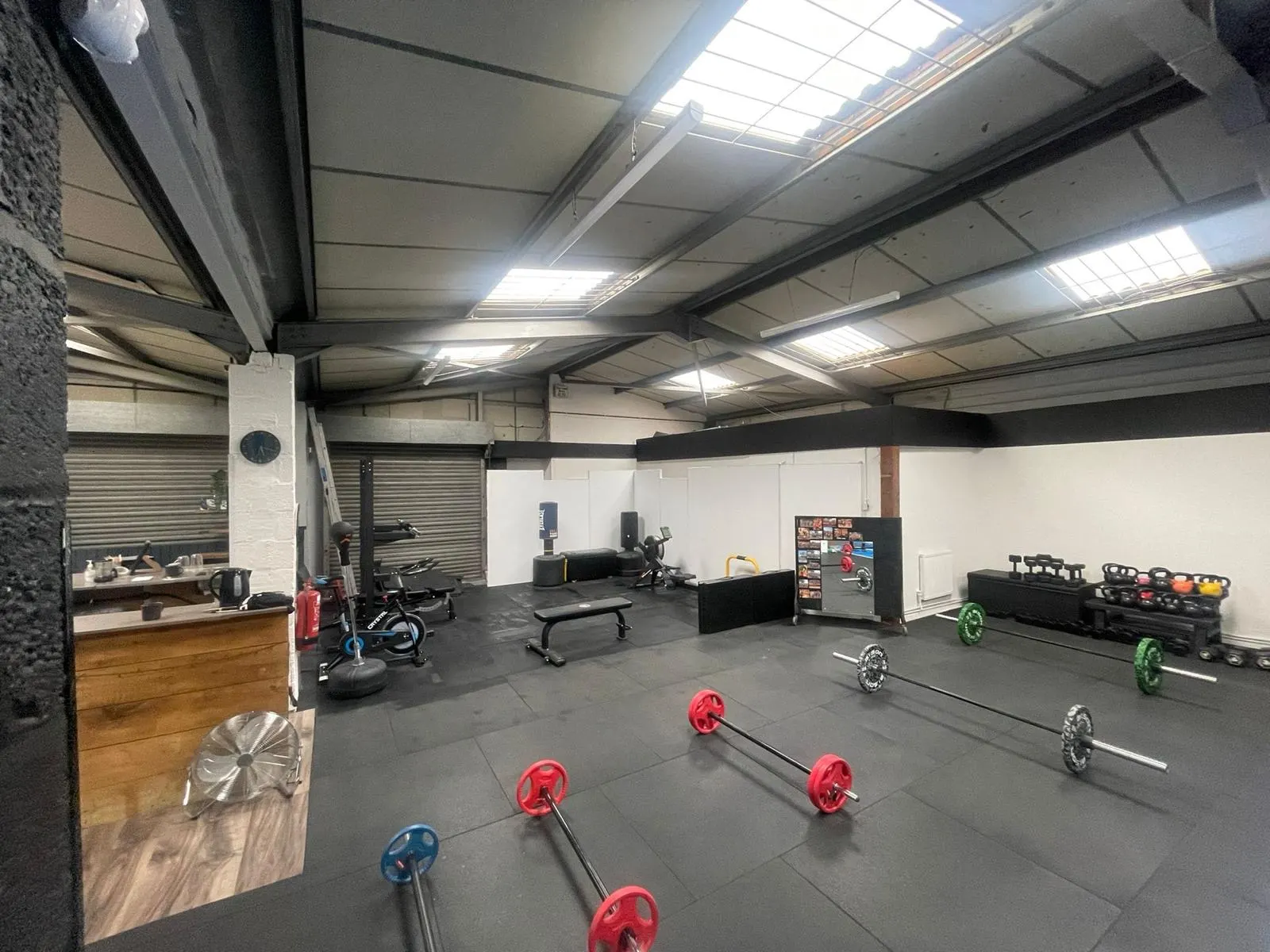 Physical Formula's new bigger gym floor in 2022, lifting platforms, racks and a clean black-rubber floor