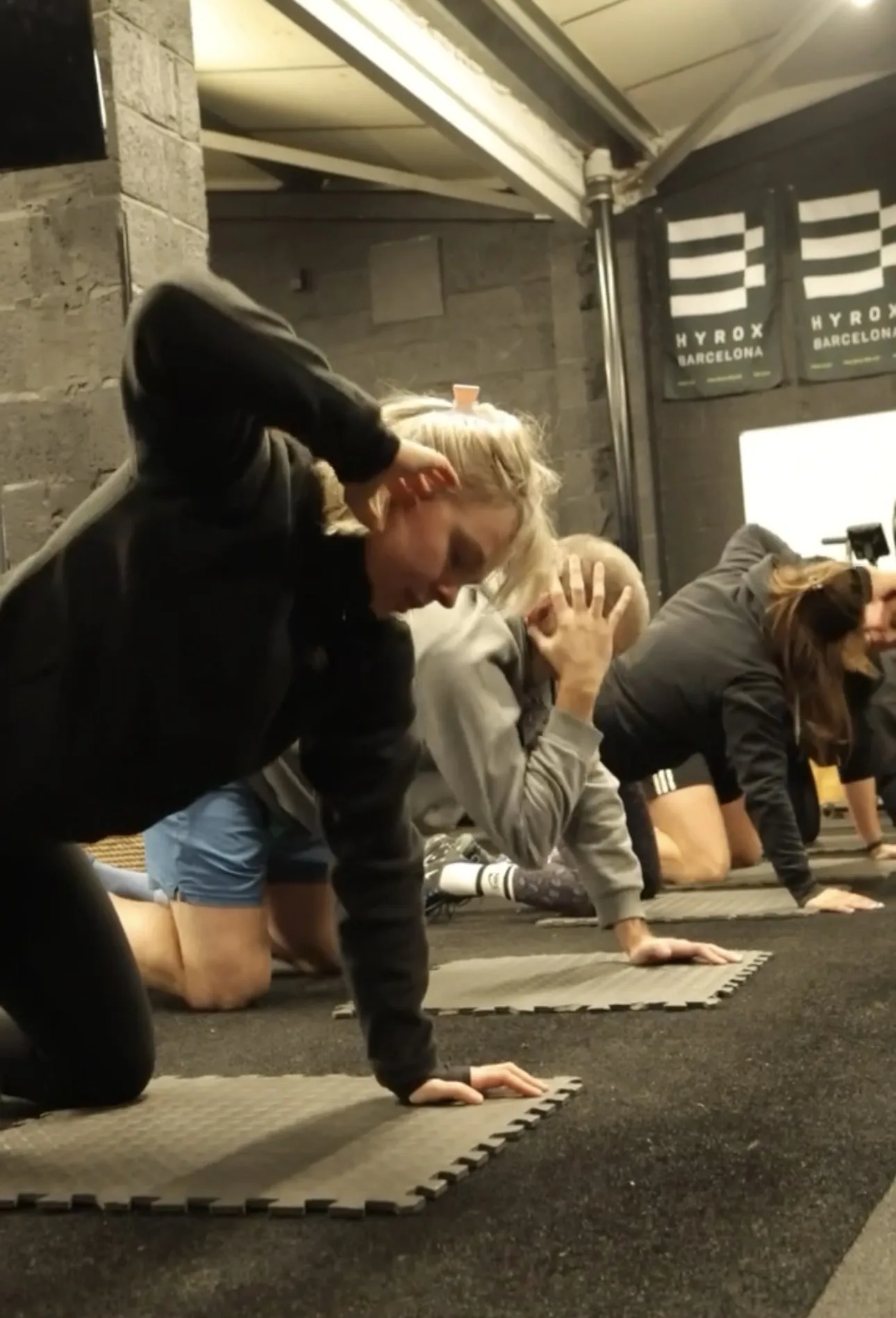 A small group warming up together on the Physical Formula floor