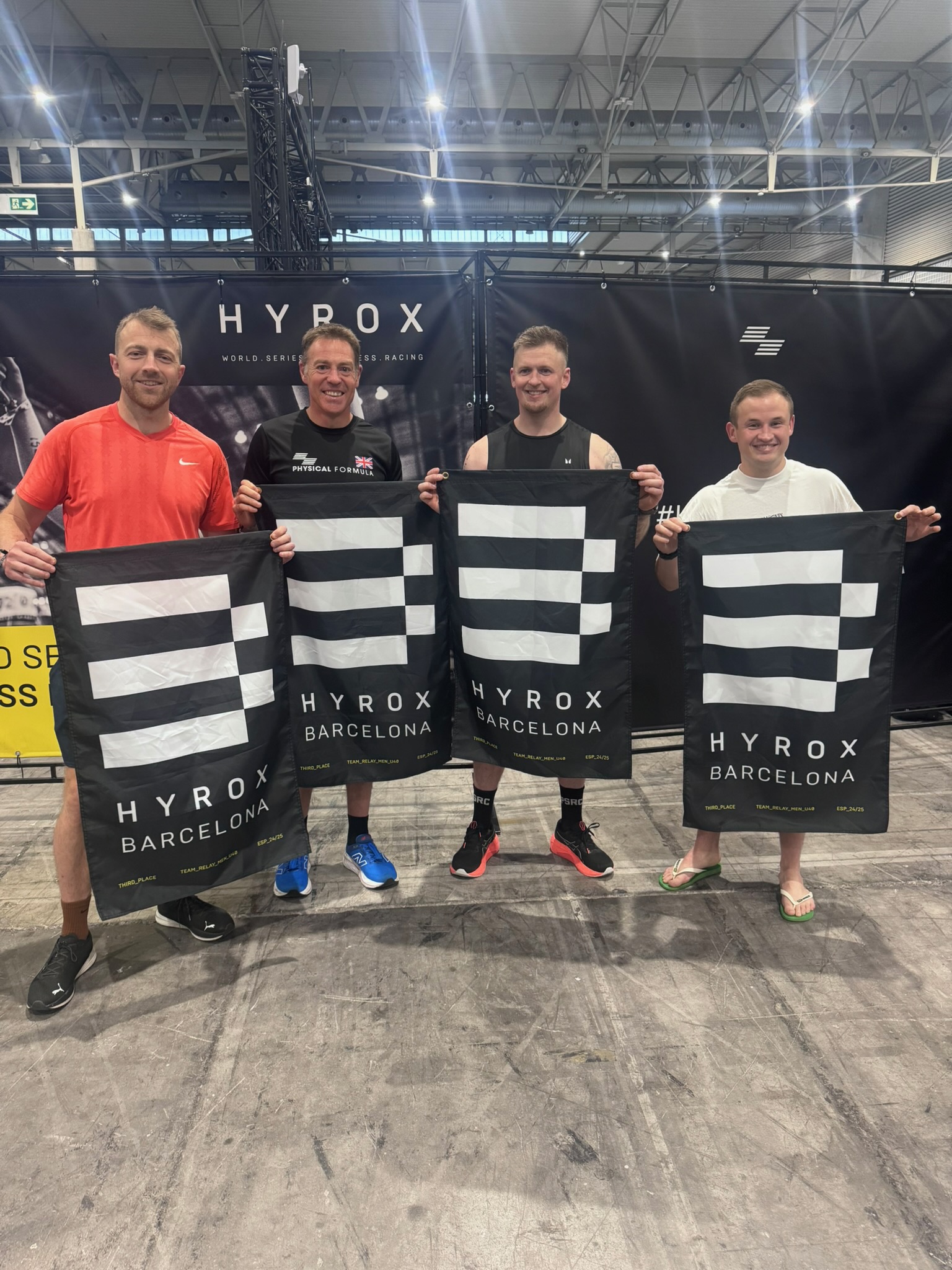 Physical Formula members at HYROX Barcelona with their finisher towels