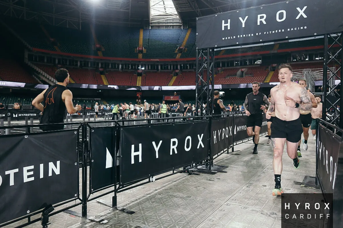Athletes running a 1km section between stations at HYROX Cardiff